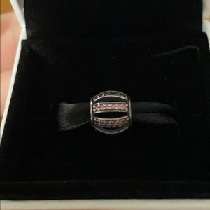Round pink cubic zirconia pandora charm.